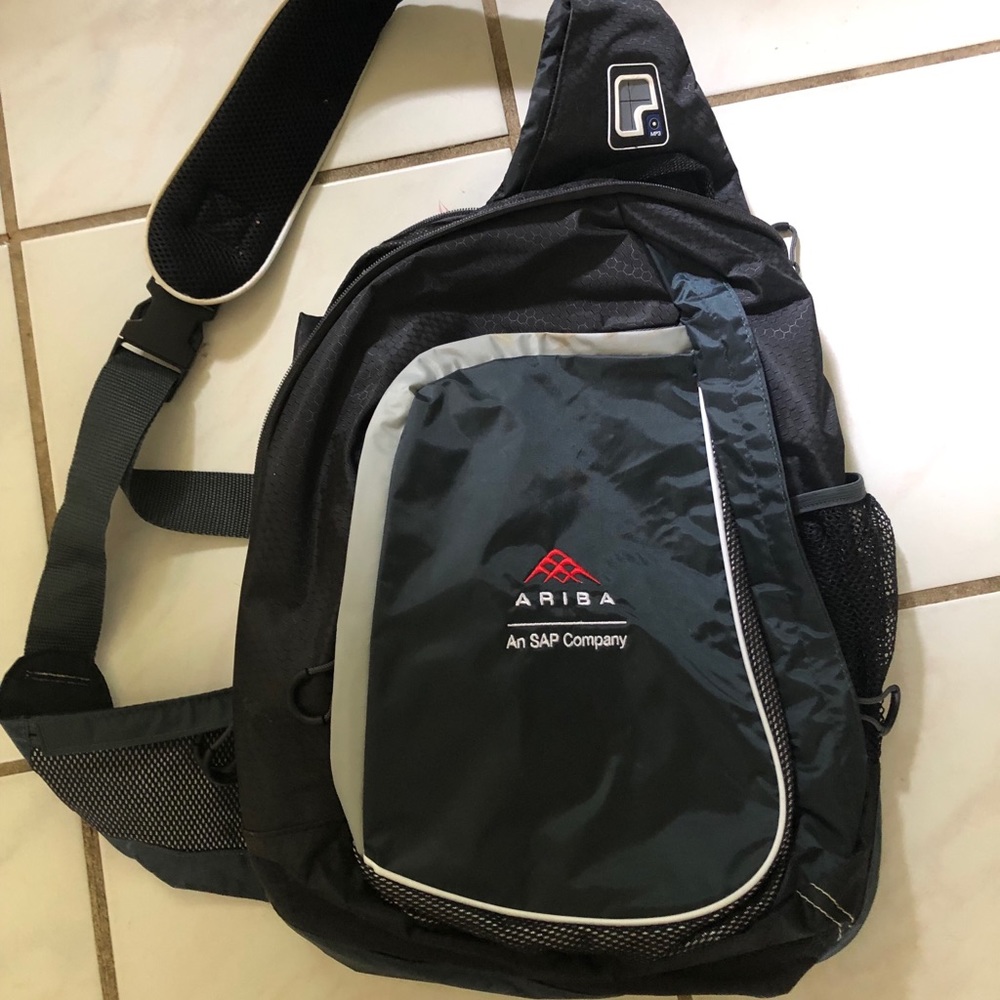 Black cross-body computer bag with Ariba logo.